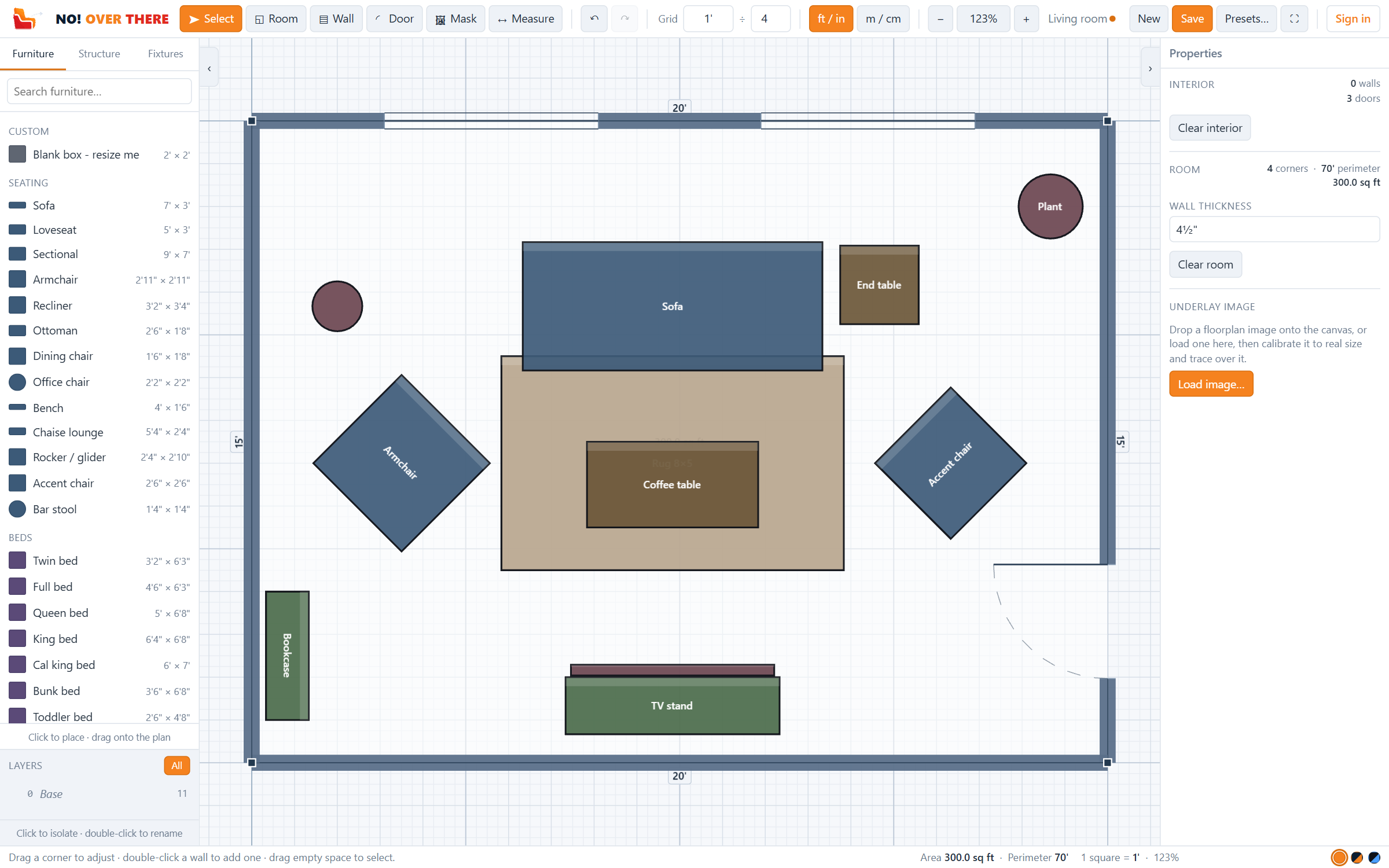 A living room planned in NO! OVER THERE: walls with two windows and a door, a sofa, armchairs, rug, coffee table and TV stand, all at real sizes on graph paper.